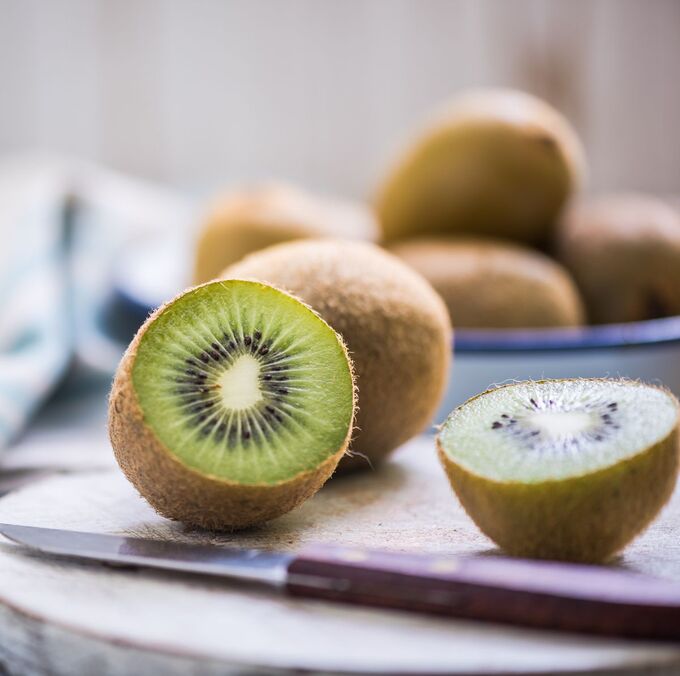 kiwi-halves-on-wooden-board-royalty-free-image-1617379685_