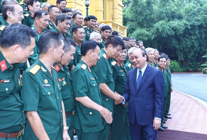 Chủ tịch nước Nguyễn Xuân Phúc tiếp đại biểu cựu chiến binh Mặt trận Vị Xuyên - Hà Tuyên